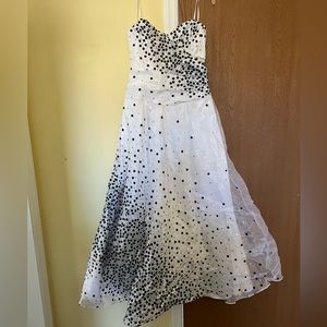 Strapless white gown with black and silver polka dots